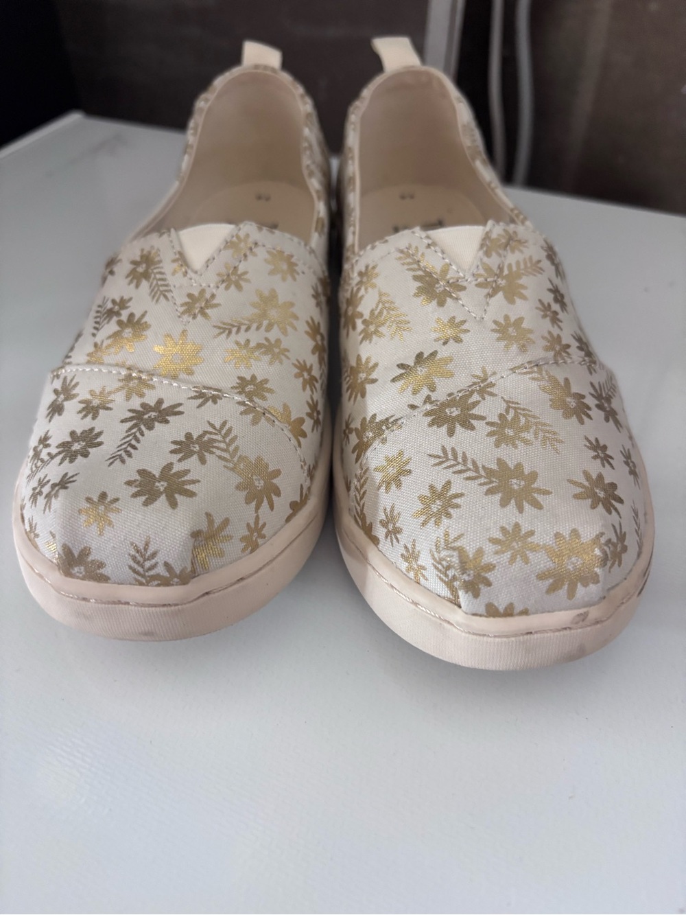 Toms Cream Canvas Slip-Ons with Gold Floral Print